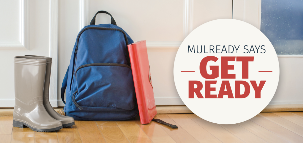 Header image with grey rain boots, navy backpack, and red file folder sitting in front of a door and a window with rain drops on the glass, and a white circle with navy and red text slogan "Mulready says Get Ready"